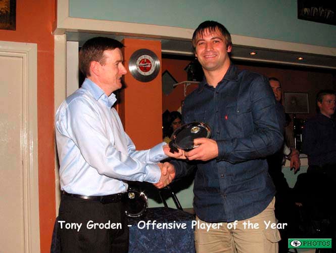 Tony Groden collects his Offensive Player of the Year award from Head Coach Jim Messenger.
