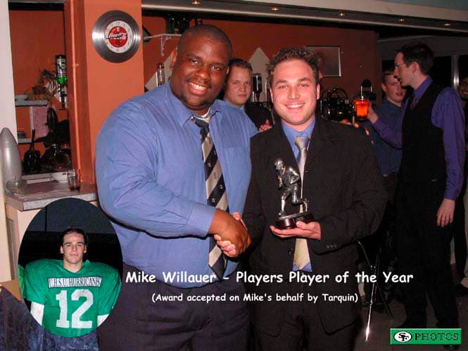 Tarquin collects the Players' Player of the Year award for Mike Willauer from President Rob Kelly.