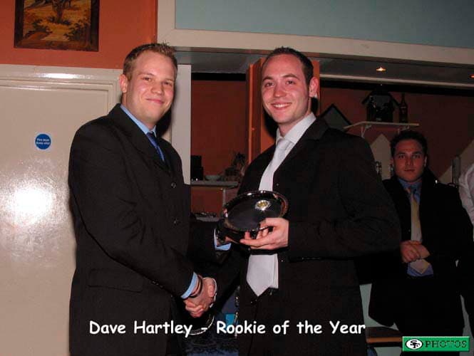 Dave Hartley receives his Rookie of the Year Award from Coach Neil White.