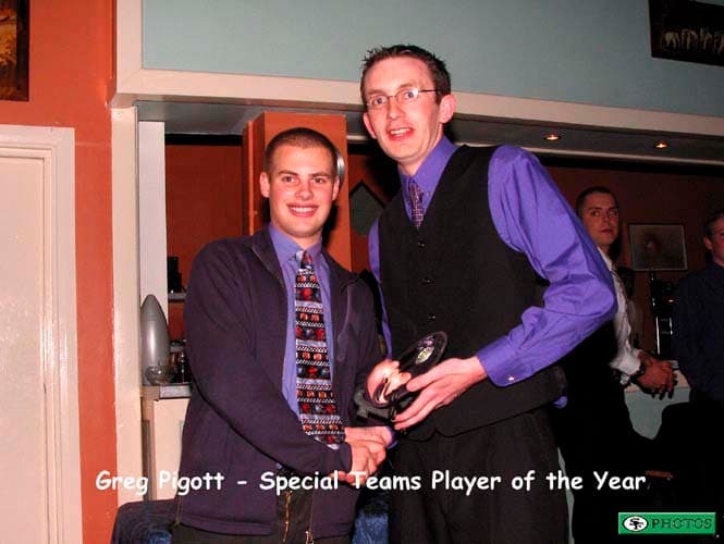 Greg Piggott collects his Special Teams Player of the Year award from Special Teams coach Anthony Fitzpatrick.