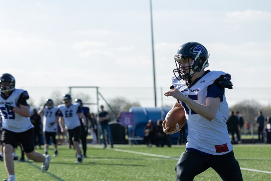 A Hurricanes quarterback, from the UH Sport news story on American football scholarships, July 2025